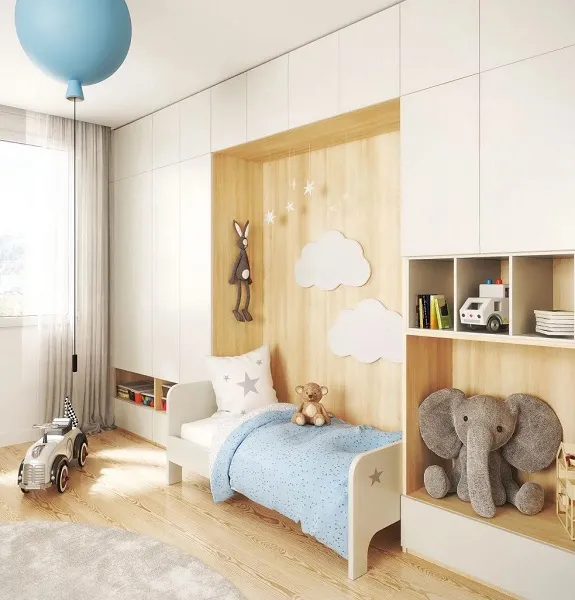 Un maximum de rangement dans cette chambre d'enfant évolutive avec pan de mur entièrement aménagé